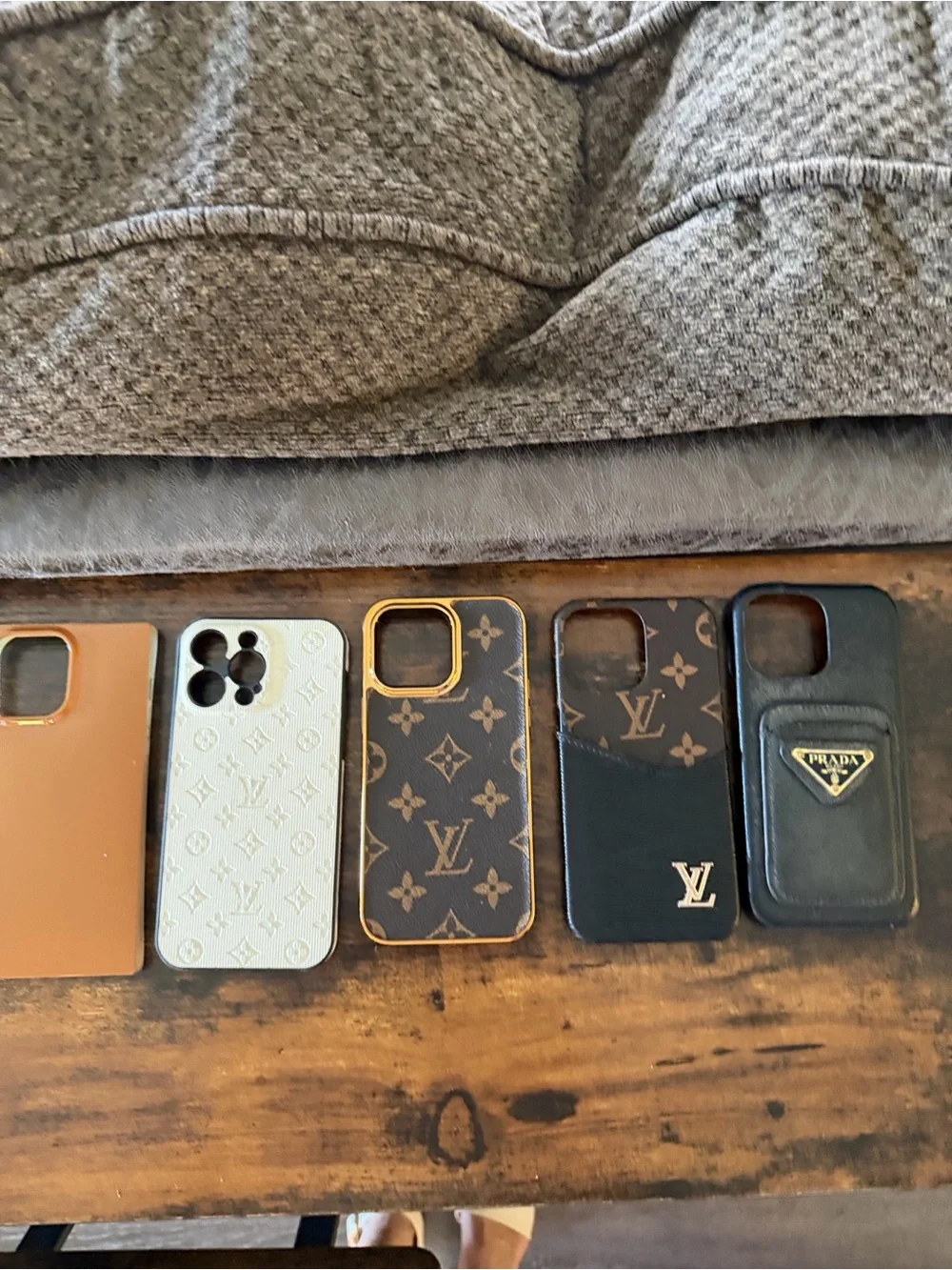 5 - iPhone 14 Pro Max cases. The brown one to the left is a flaunt case.